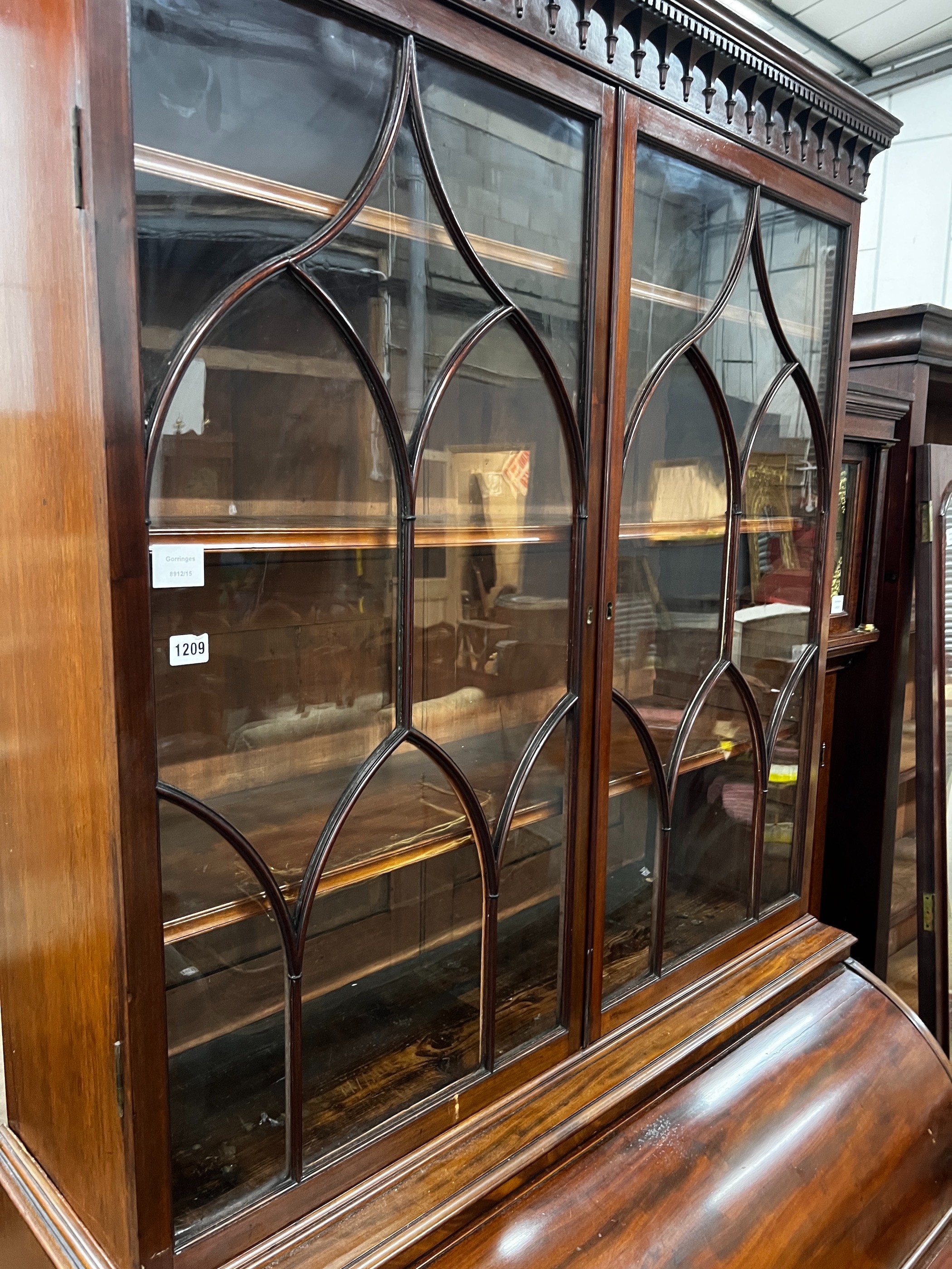 A George III mahogany cylinder bureau bookcase with glazed panelled doors, width 115cm, depth 60cm, height 227cm